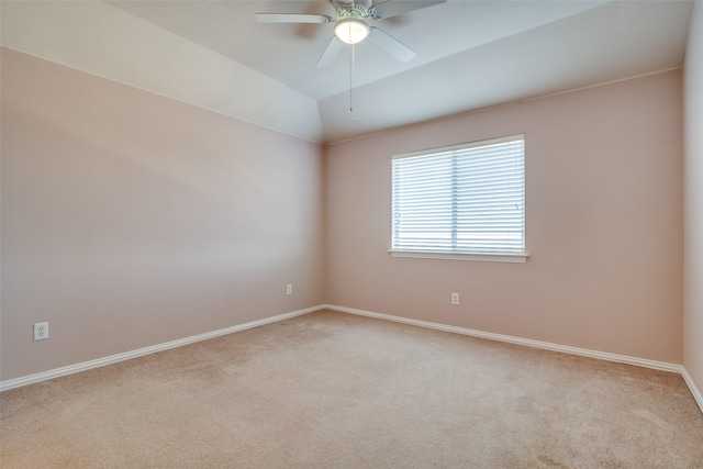 unfurnished room featuring ceiling fan, lofted ceiling, and light carpet