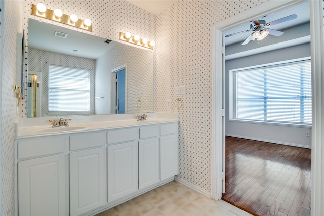 bathroom with hardwood / wood-style flooring, vanity, and ceiling fan