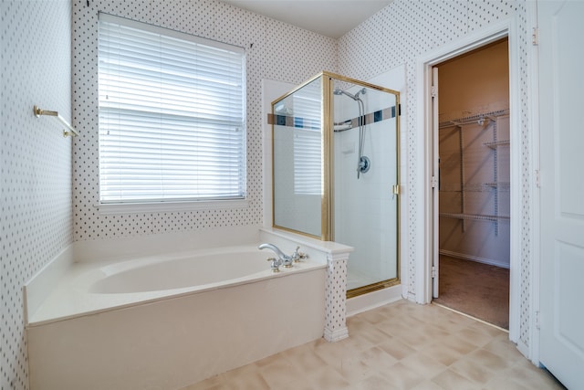 bathroom with separate shower and tub