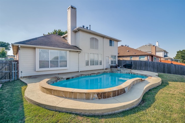 view of pool with a lawn