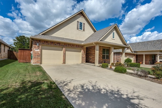 view of front property with a garage and a front lawn