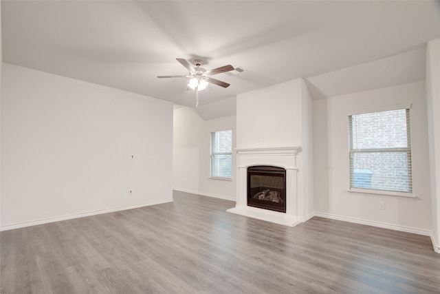 unfurnished living room featuring wood-type flooring and ceiling fan