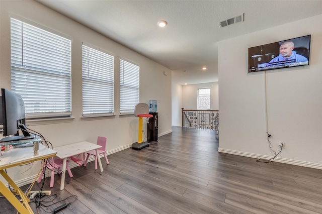 recreation room with hardwood / wood-style flooring