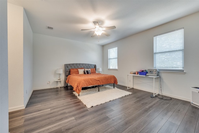 bedroom with wood-type flooring and ceiling fan