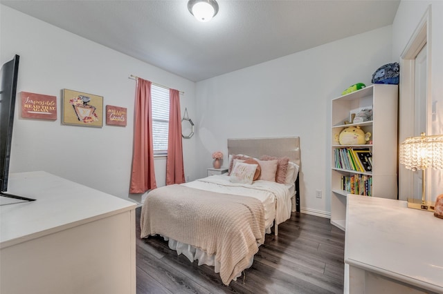 bedroom featuring dark hardwood / wood-style flooring