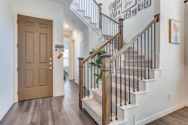 foyer with wood-type flooring