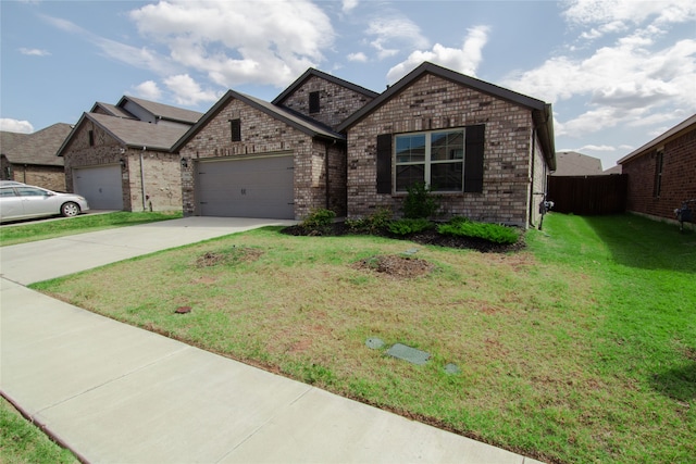 view of front of property with a garage and a front yard