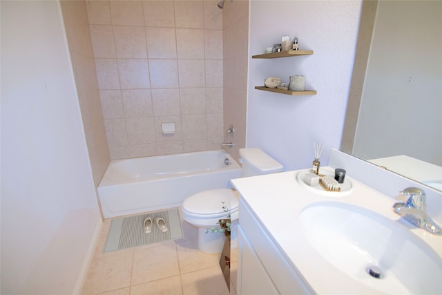 full bathroom with vanity, tiled shower / bath combo, toilet, and tile patterned flooring