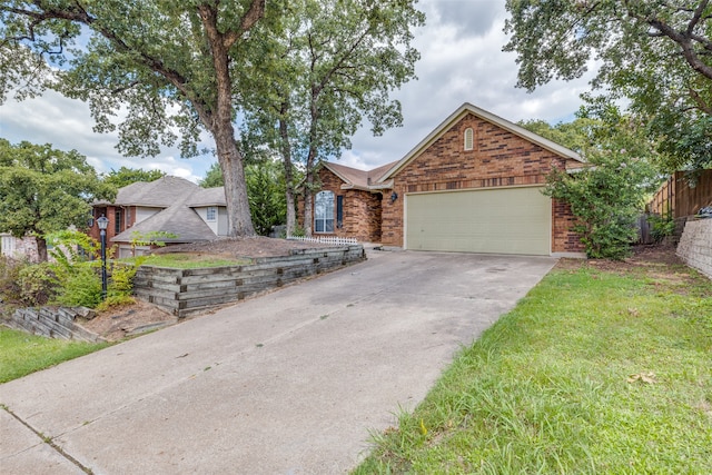 view of front facade with a garage and a front yard