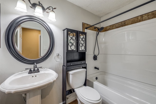 full bathroom with toilet, sink, shower / bathing tub combination, and a textured ceiling