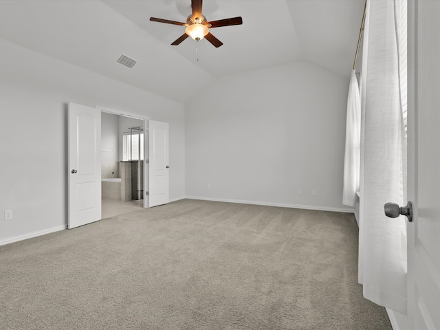 carpeted empty room featuring lofted ceiling and ceiling fan