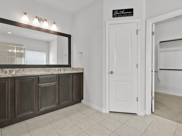 bathroom with vanity and tile patterned floors