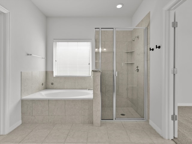 bathroom featuring shower with separate bathtub and tile patterned floors