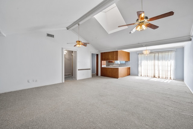 unfurnished living room with light carpet, beam ceiling, high vaulted ceiling, and ceiling fan