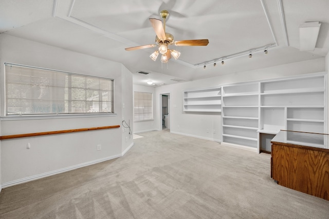 unfurnished living room featuring track lighting, light carpet, and ceiling fan