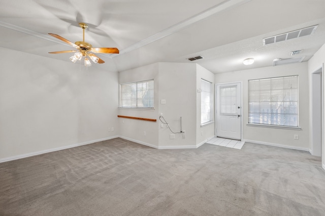 unfurnished living room with light colored carpet and ceiling fan