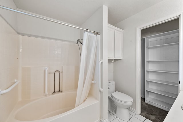 bathroom featuring tile patterned flooring, shower / bath combo, and toilet