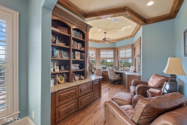 office area featuring crown molding, light hardwood / wood-style floors, and a wealth of natural light