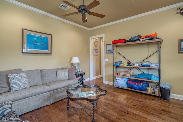 living room featuring ceiling fan, ornamental molding, and dark hardwood / wood-style flooring