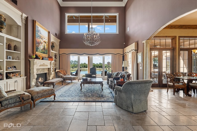 kitchen featuring dishwasher, a breakfast bar area, hanging light fixtures, and ornate columns