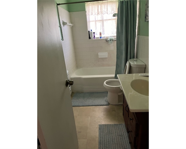 full bathroom with vanity, toilet, tile patterned floors, and shower / bathtub combination with curtain