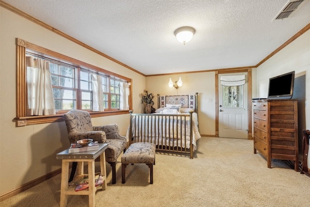 bedroom featuring ornamental molding, a textured ceiling, and carpet flooring