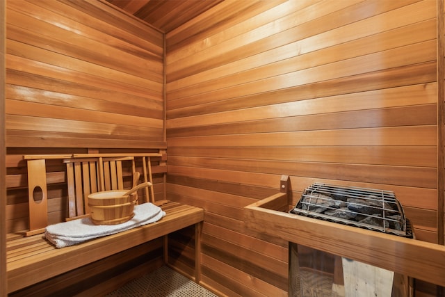 view of sauna / steam room featuring wooden walls