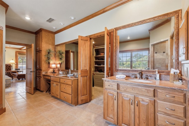 bathroom with vanity, tile patterned floors, a shower, and a wealth of natural light