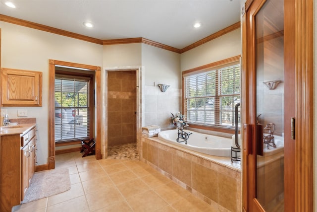 bathroom featuring vanity, ornamental molding, independent shower and bath, and tile patterned flooring