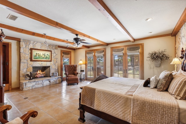 tiled bedroom featuring access to outside, a fireplace, a textured ceiling, ceiling fan, and beam ceiling