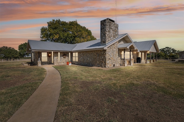 view of front of property with a yard