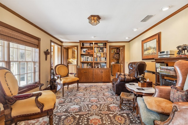 living area featuring ornamental molding