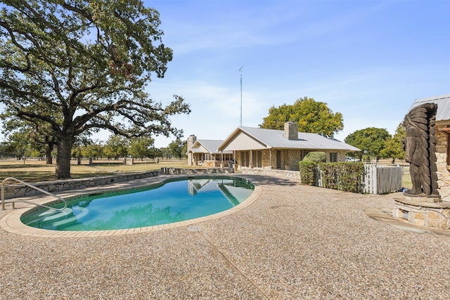 view of swimming pool with a patio