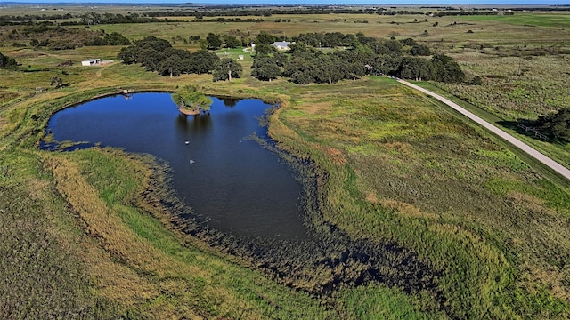 bird's eye view with a water view and a rural view