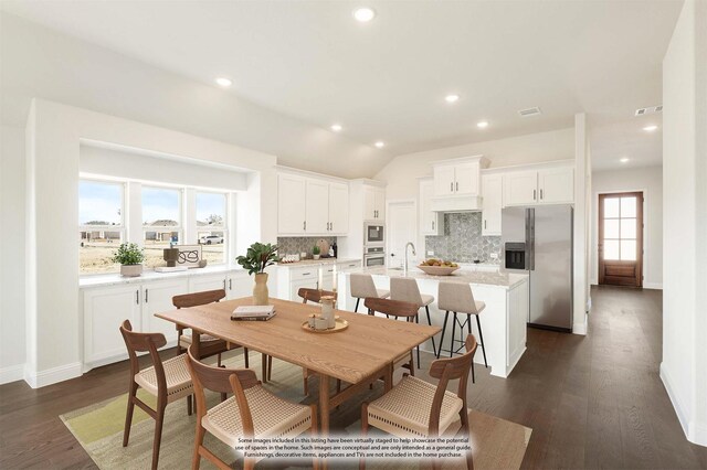 dining room with a wealth of natural light, ceiling fan, and lofted ceiling