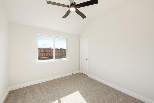 bedroom with light carpet, ensuite bathroom, ceiling fan, and lofted ceiling