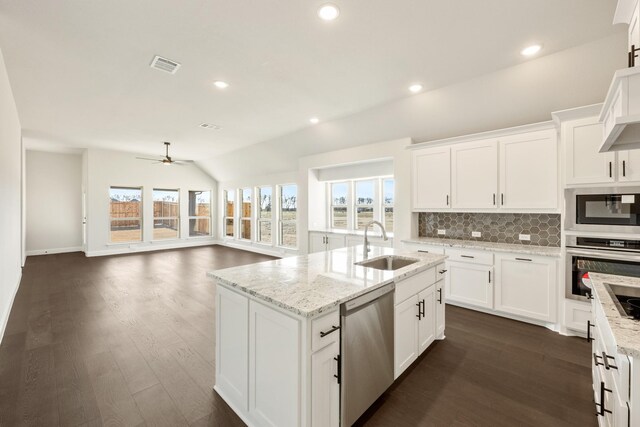 living room with ceiling fan and lofted ceiling