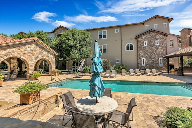 view of pool featuring a patio area