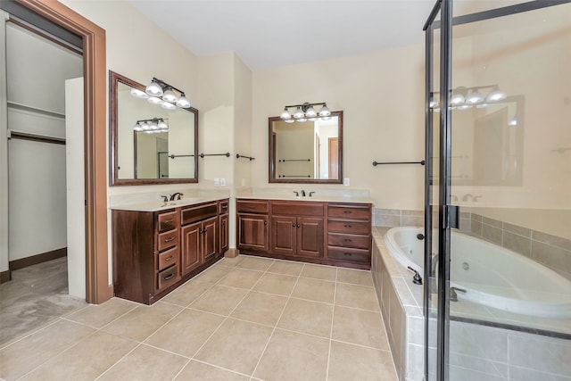 bathroom featuring tile patterned flooring, separate shower and tub, and vanity