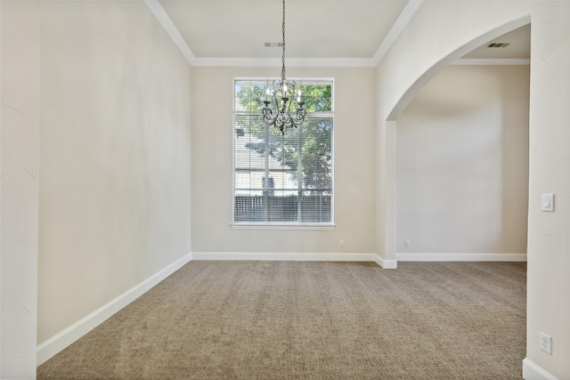 unfurnished room with crown molding, a chandelier, and carpet