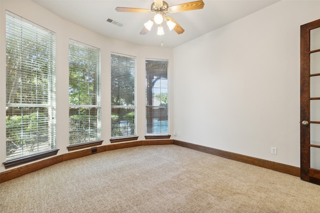 unfurnished room with carpet floors and ceiling fan