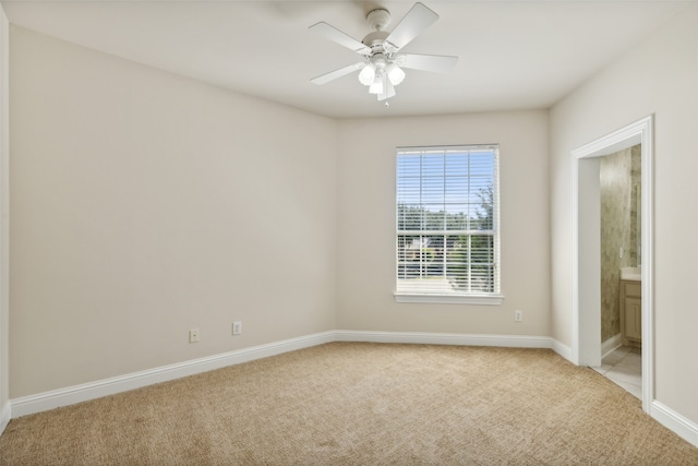 carpeted empty room with ceiling fan