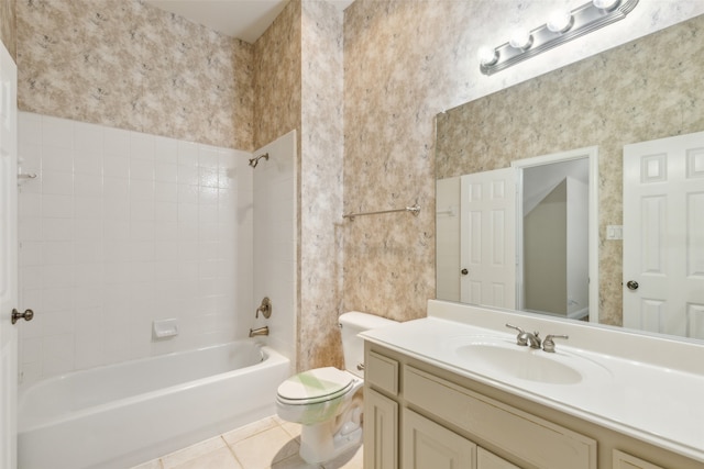 full bathroom with vanity, tiled shower / bath combo, toilet, and tile patterned flooring