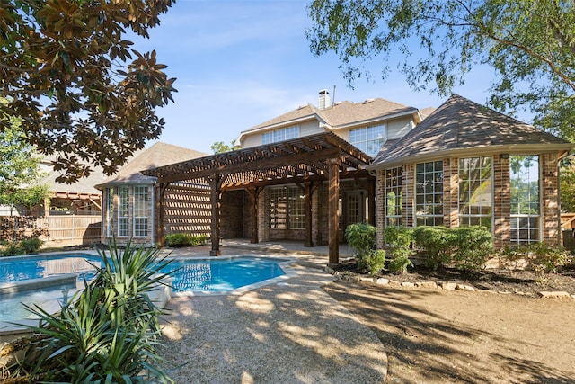 view of swimming pool featuring a pergola and a patio