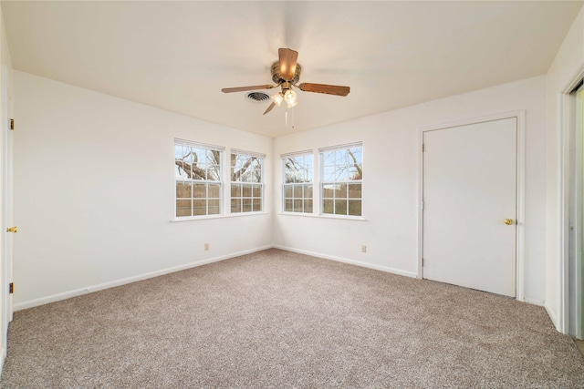 unfurnished bedroom with ceiling fan and carpet floors