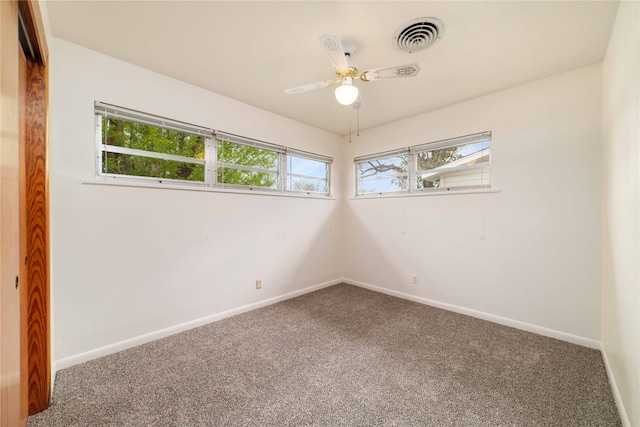 empty room with carpet flooring and ceiling fan