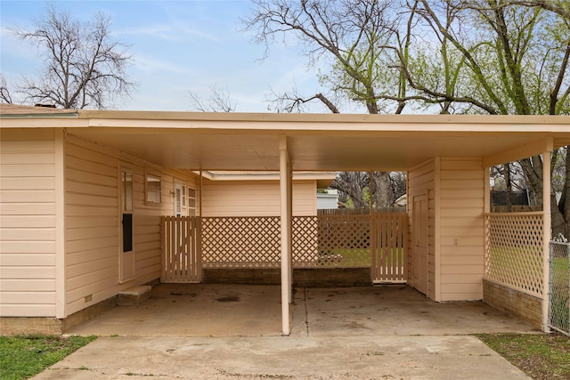 view of parking / parking lot featuring a carport