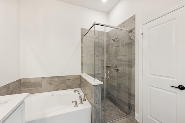 bathroom with vanity and plus walk in shower