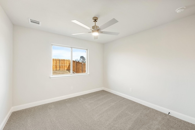 carpeted empty room featuring ceiling fan