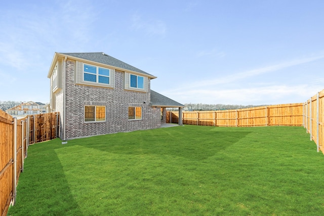 back of house featuring a lawn